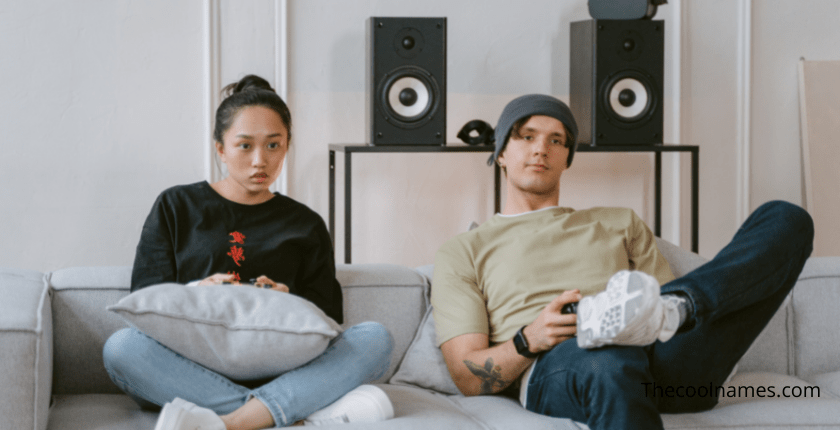 Boy and Girl Sitting on Sofa